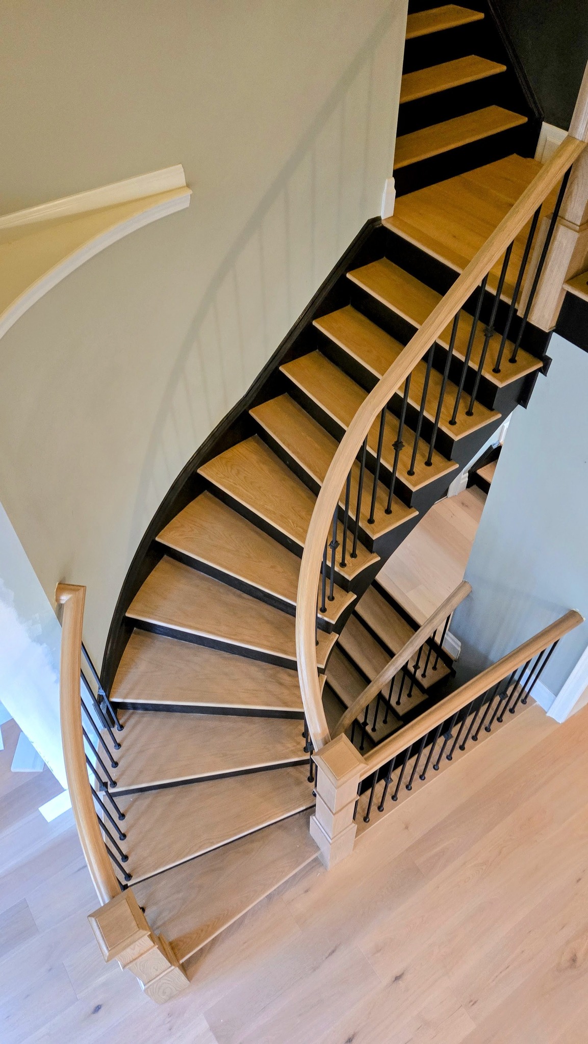 Kitchen renovation with oversized island and warm finishes